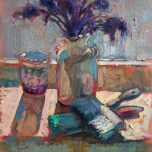 Still life painting with purple flowers in a white vase, brushes and a glass, illuminated by the sunlight