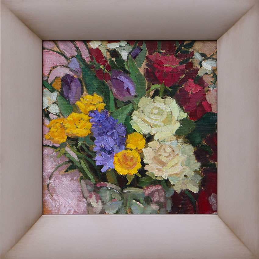 Painting in a frame depicting colorful flowers