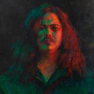 Portrait of a man with red and green lighting