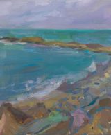 Turquoise sea and a rocky shore with waves crashing against the rocks